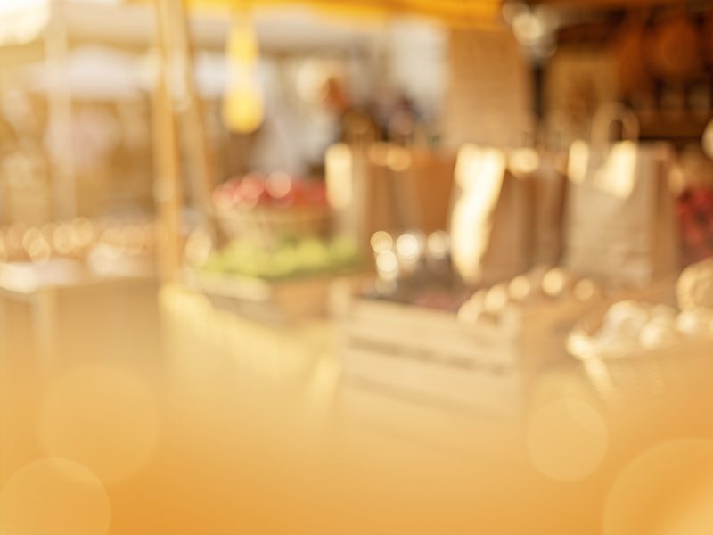 Warm, blurred market stalls at a local shop
